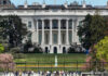 The White House with tourists in the foreground.