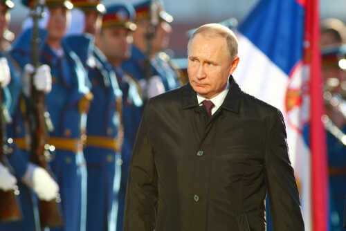 shutterstock_1468367888 (1).jpg A political figure walking past a military honor guard during a ceremony