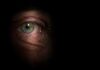 Close-up of a human eye with a dark background