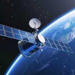 Satellite orbiting Earth with solar panels visible