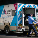 MTA Worker BEATEN After Brain Surgery A healthcare worker pushing a stretcher next to an ambulance