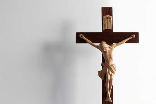 shutterstock_1910603275.jpg Wooden crucifix with a figure of Jesus Christ