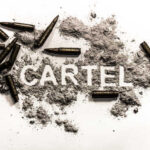 The word 'CARTEL' formed with gunpowder and surrounded by bullets