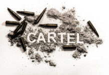 The word 'CARTEL' formed with gunpowder and surrounded by bullets