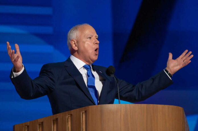 Man giving a speech with arms raised