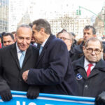 Politicians engaging in conversation at a public rally