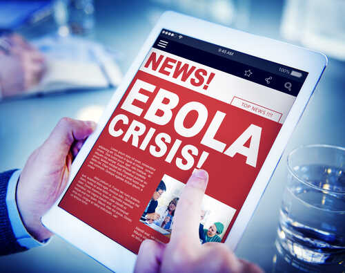Person reading news about the Ebola crisis on a tablet