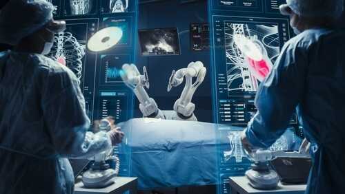 Surgeons using robotic arms in a high-tech operating room