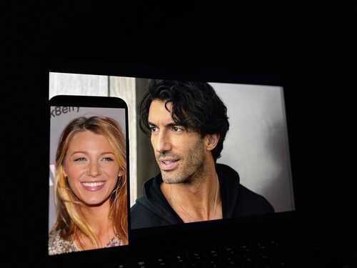 shutterstock_2561666431.jpg A laptop screen displaying two celebrity portraits, one larger and one smaller