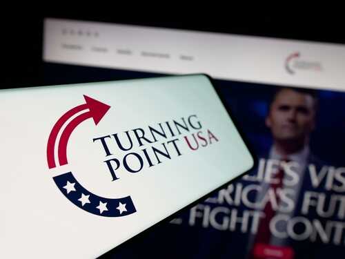 shutterstock_2697756557.jpg Turning Point USA logo displayed on a smartphone screen
