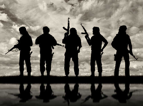 Silhouetted figures holding rifles against a cloudy sky
