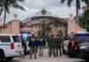 FBI agents and police vehicles at the entrance of Mar-a-Lago Club