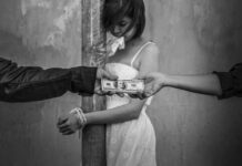 A woman in a white dress appears distressed while two hands exchange money