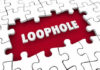 A puzzle piece with the word 'LOOPHOLE' highlighted in white against a red background