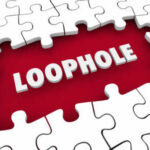 A puzzle piece with the word 'LOOPHOLE' highlighted in white against a red background