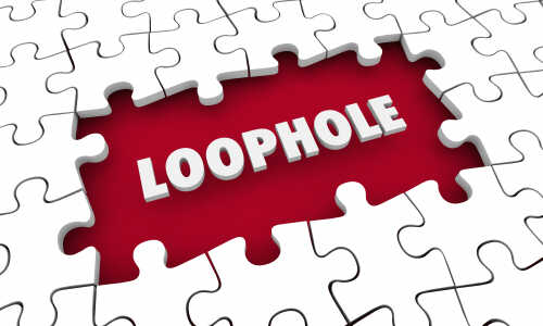 A puzzle piece with the word 'LOOPHOLE' highlighted in white against a red background