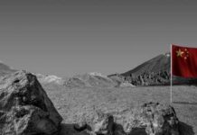 DIVINE Victory: America CRUSHES China’s Moon Dreams A Chinese flag stands in a barren, monochrome landscape with mountains in the background