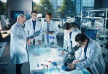 Human Brains Kept Alive For Drug Tests Group of scientists in a laboratory working together on experiments