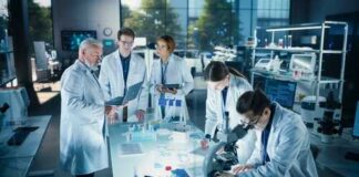 Group of scientists in a laboratory working together on experiments