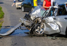Severely damaged car after a collision on the road