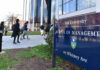 Dorm Horror Sparks Sheriff Showdown People walking outside Yale School of Management building