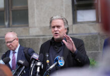 Daylight Ambush Shocks Chicago’s Museum Mile Man speaking at press conference with microphones.