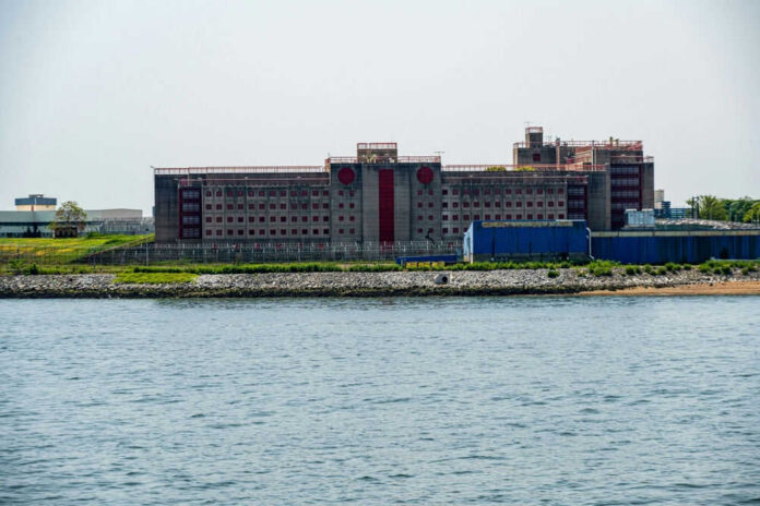 Building by the water with fenced perimeter