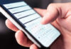 Digital ID Crackdown Hits Home Close-up of a hand using a smartphone to enter information