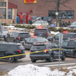 New Video Ignites School Safety Firestorm Multiple police vehicles at a scene with caution tape and emergency lights activated