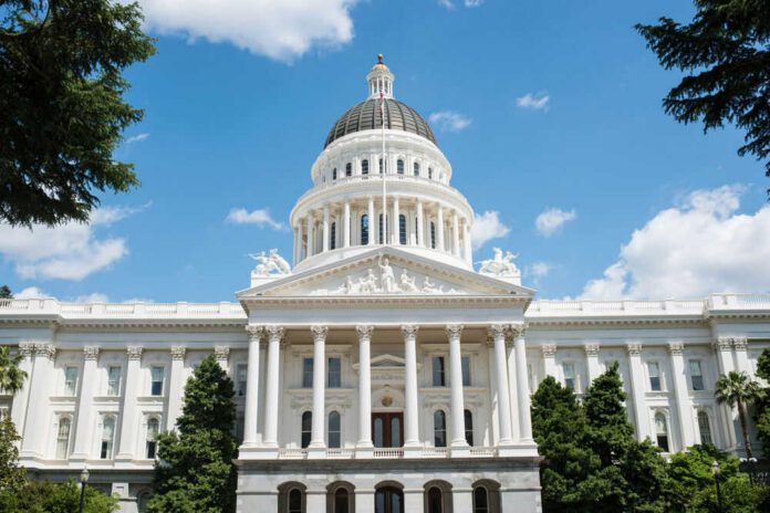 White domed capitol building with blue sky background