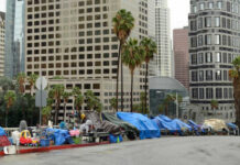Trump’s Bold Move Rattles Blue States Street lined with tents and makeshift shelters downtown.