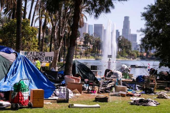 1944180406 Homeless encampment in a park with a view of the Los Angeles skyline