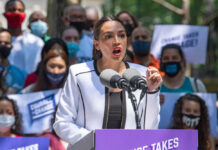 Carville Torches AOC’s 2028 Dream Person speaking at a public event with crowd.