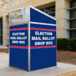 Court Greenlights USPS Ballot Crackdown Blue election mail ballot drop box outside building.