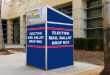 Court Greenlights USPS Ballot Crackdown Blue election mail ballot drop box outside building.