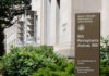 Exterior view of the Robert F. Kennedy Department of Justice Building with a sign