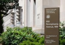 Family Feud Explodes Inside DOJ Exterior view of the Robert F. Kennedy Department of Justice Building with a sign