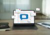 Laptop displaying email notifications with a message icon