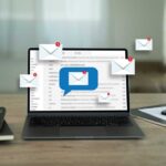 Laptop displaying email notifications with a message icon