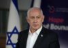 Blistering On-Air Takedown Rattles Democrats A political leader speaking at a press conference with the Israeli flag in the background
