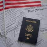 Crimes, DUI, Fraud — Then This A U.S. passport, birth certificate, and American flags on a table
