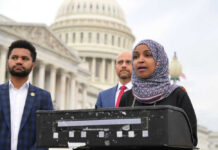 Iran Blitz Sparks MAGA Civil War Three people speaking in front of US Capitol building