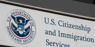 U.S. Citizenship and Immigration Services building sign.