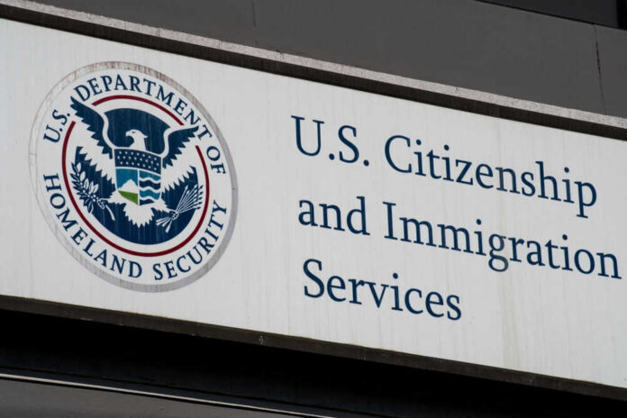 2488287035 U.S. Citizenship and Immigration Services building sign.