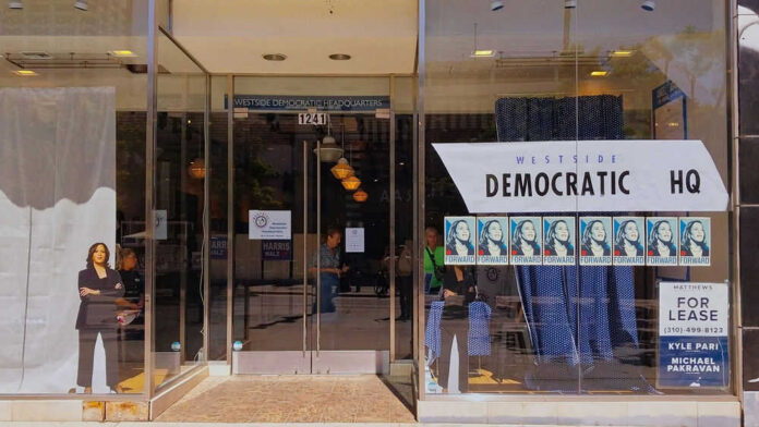 Storefront of Westside Democratic Headquarters with signs.