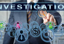 Businessman pointing at investigation themed icons