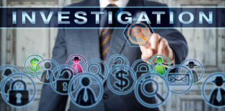 Businessman pointing at investigation themed icons