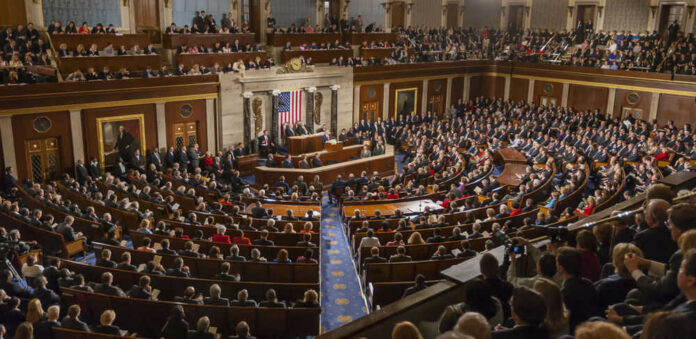 492045100 People in a large government assembly hall meeting