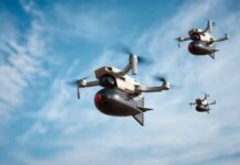 Drone Carnage Rewrites War Three drones flying against a blue sky