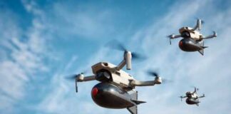 Three drones flying against a blue sky